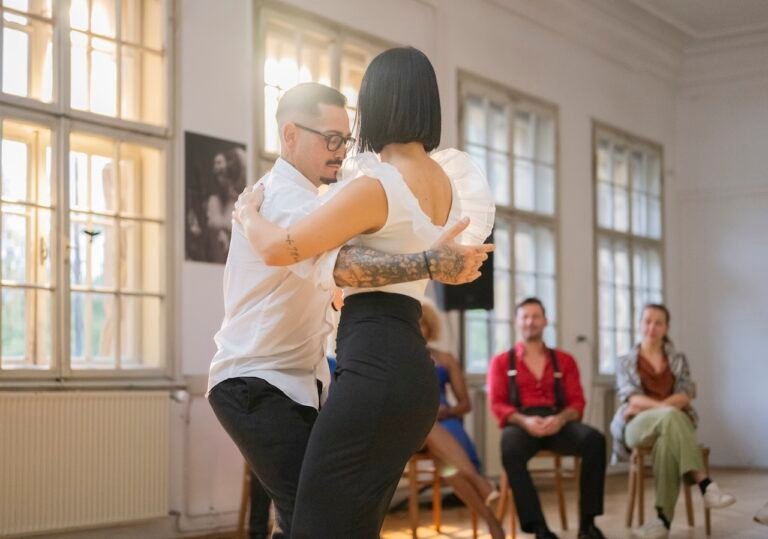 Dance instructor demonstrating moves for students.